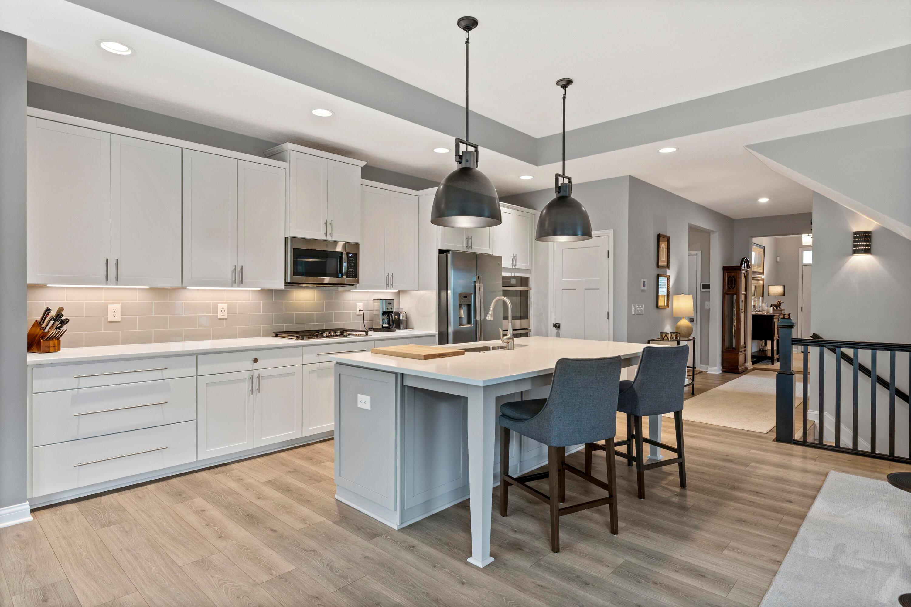 3604 Whispering Pines Road Delaware, OH 43015 - Photo 29 of 58 Gourmet quartz Island kitchen with lovely stainless steel appliances.