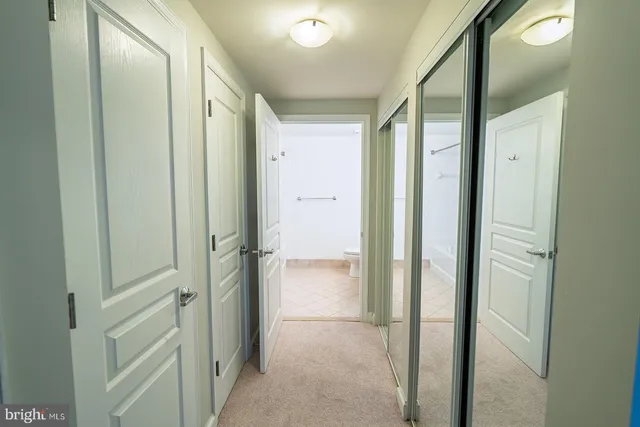 a bathroom with a granite countertop sink toilet a mirror and a shower