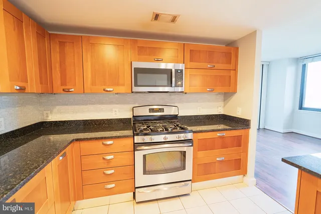 a kitchen with a stove and a microwave