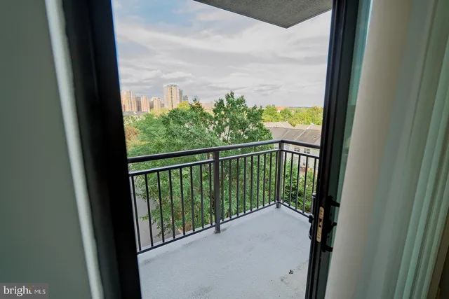 a view of balcony and trees