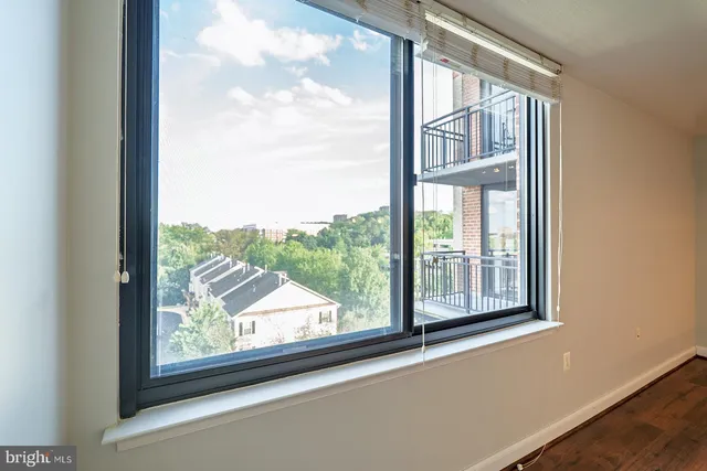 a view of a room that has a large window