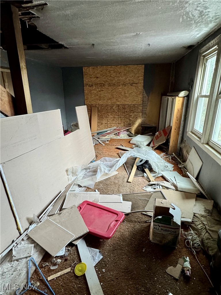 6573 Williams Road Painesville, OH 44077 - Photo 9 of 32 Miscellaneous room with a textured ceiling