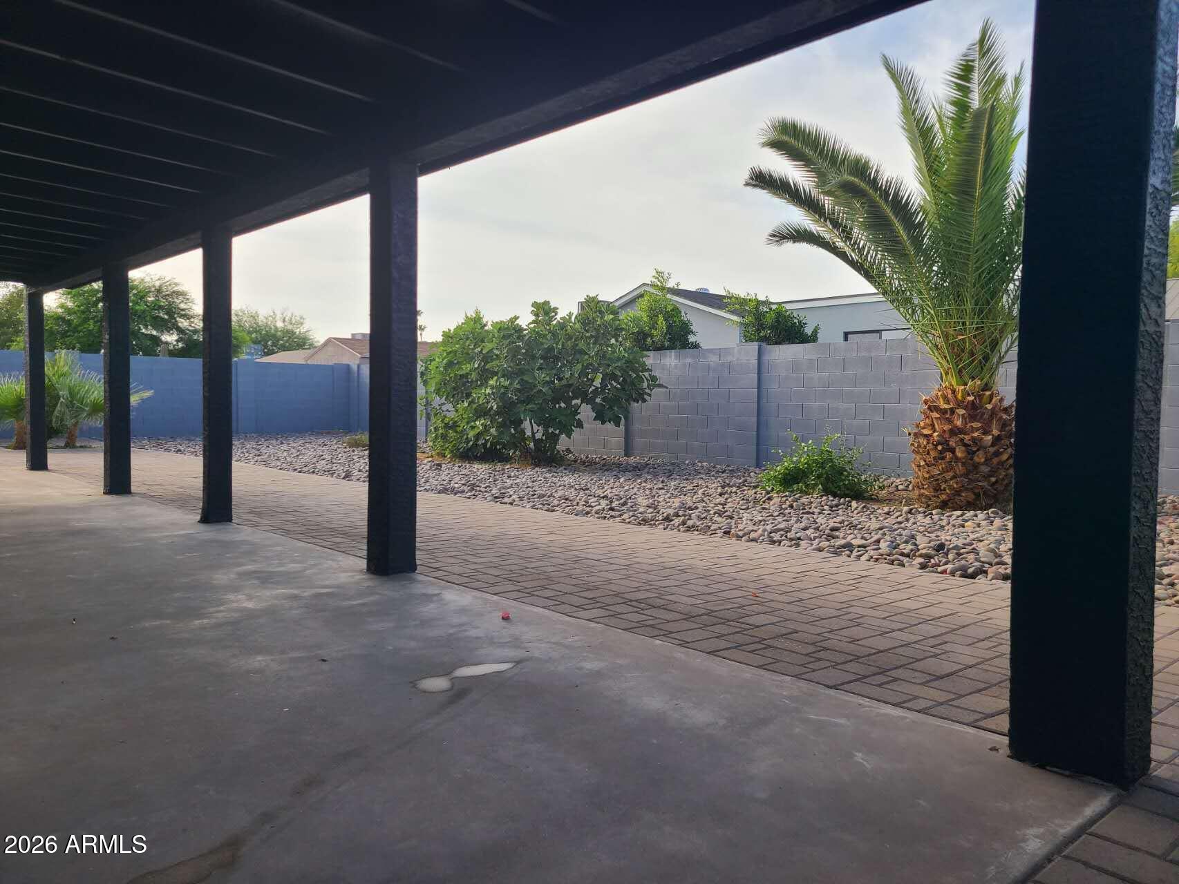 3702 East Thunderbird Road Phoenix, AZ 85032 - Photo 21 of 23 a view of a porch with a table and chairs next to a road