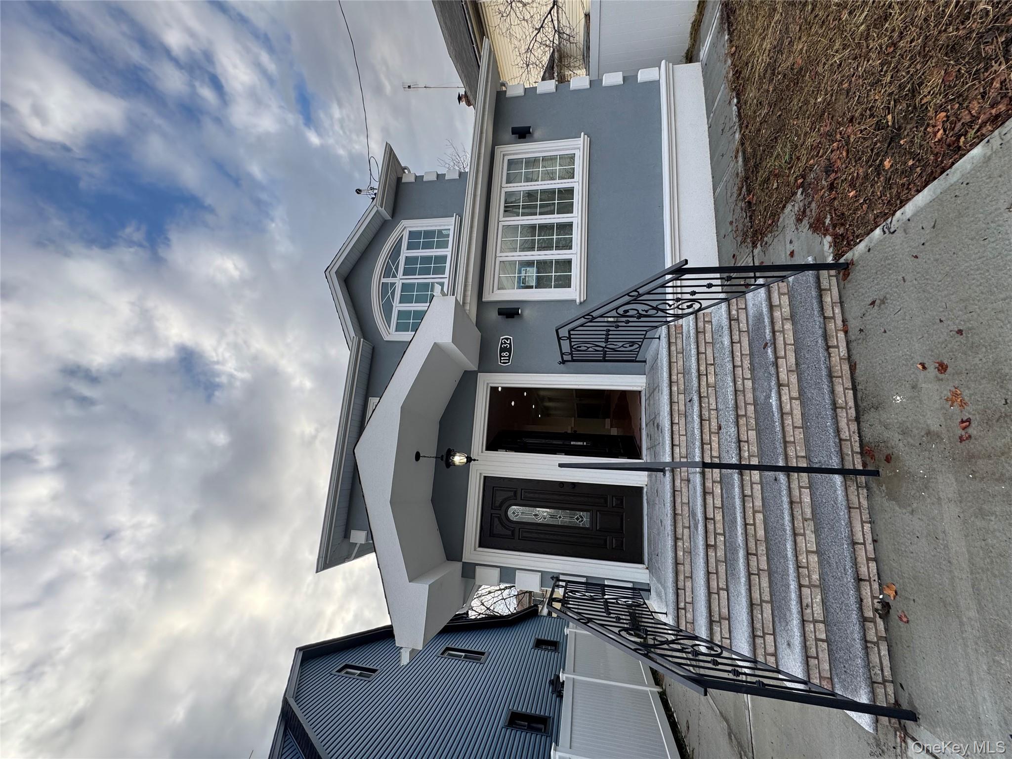 View of front of house with stucco siding