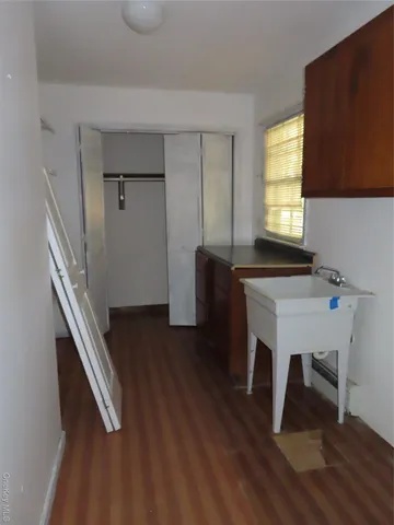 a view of entryway with wooden floor and workspace