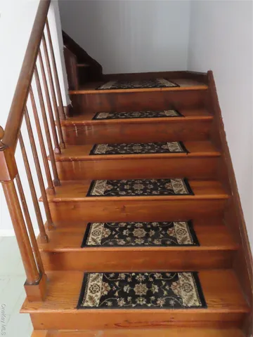 a view of entryway with wooden floor