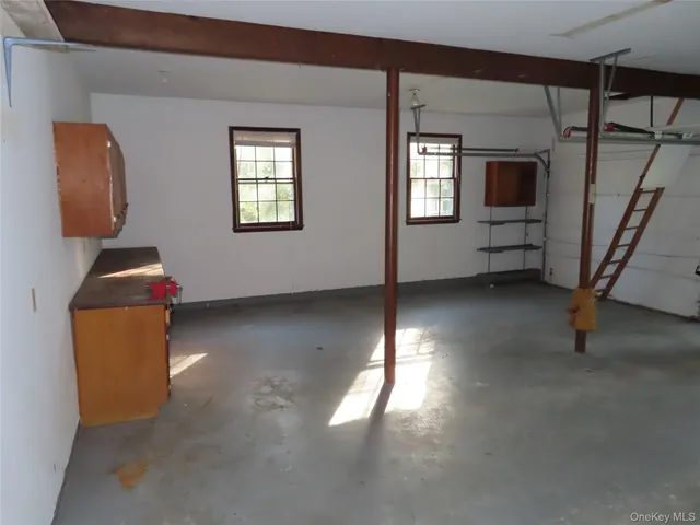 a view of a livingroom with furniture and windows