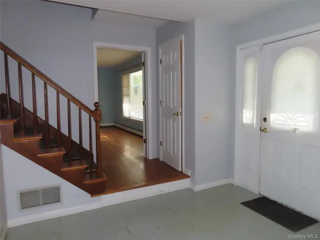 a view of a hallway view with staircase