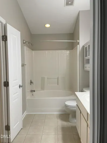 a bathroom with a toilet a sink and bathtub
