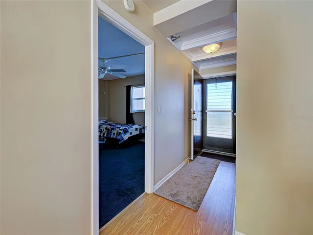 a view of hallway with wooden floor