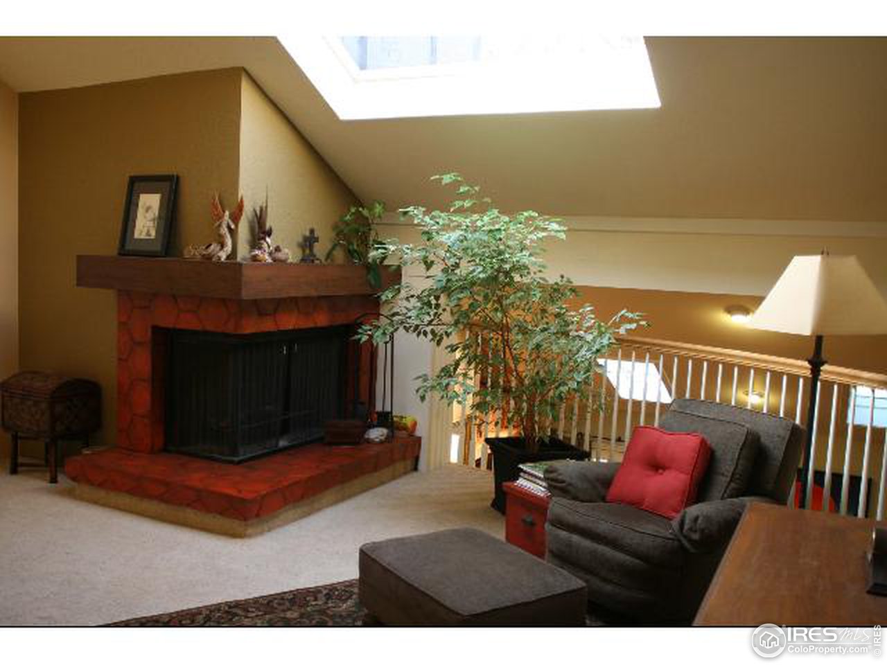 7121 Four Rivers Road Boulder, CO 80301 - Photo 11 of 17 a living room with furniture and a fireplace