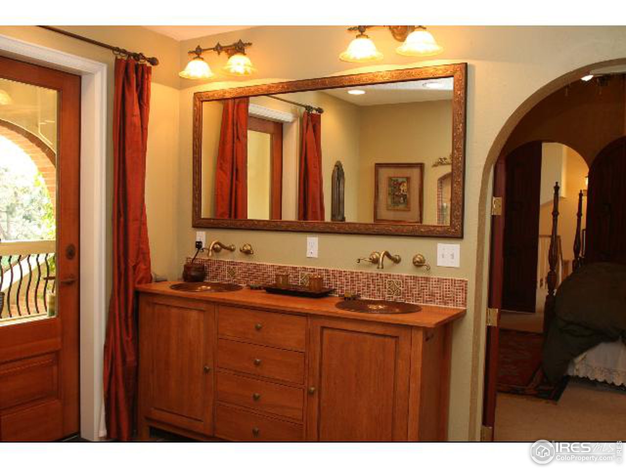 7121 Four Rivers Road Boulder, CO 80301 - Photo 9 of 17 a bathroom with a sink and a mirror