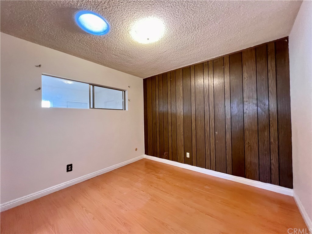 8716 Duarte Road San Gabriel, CA 91775 - Photo 15 of 21 a view of an empty room with wooden floor