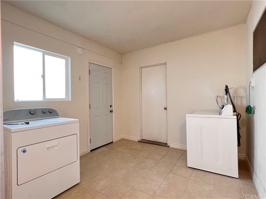 8716 Duarte Road San Gabriel, CA 91775 - Photo 19 of 21 a utility room with dryer and washer
