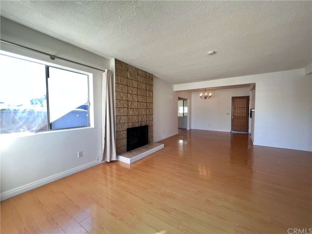 8716 Duarte Road San Gabriel, CA 91775 - Photo 4 of 21 a view of an empty room with a window and fire place