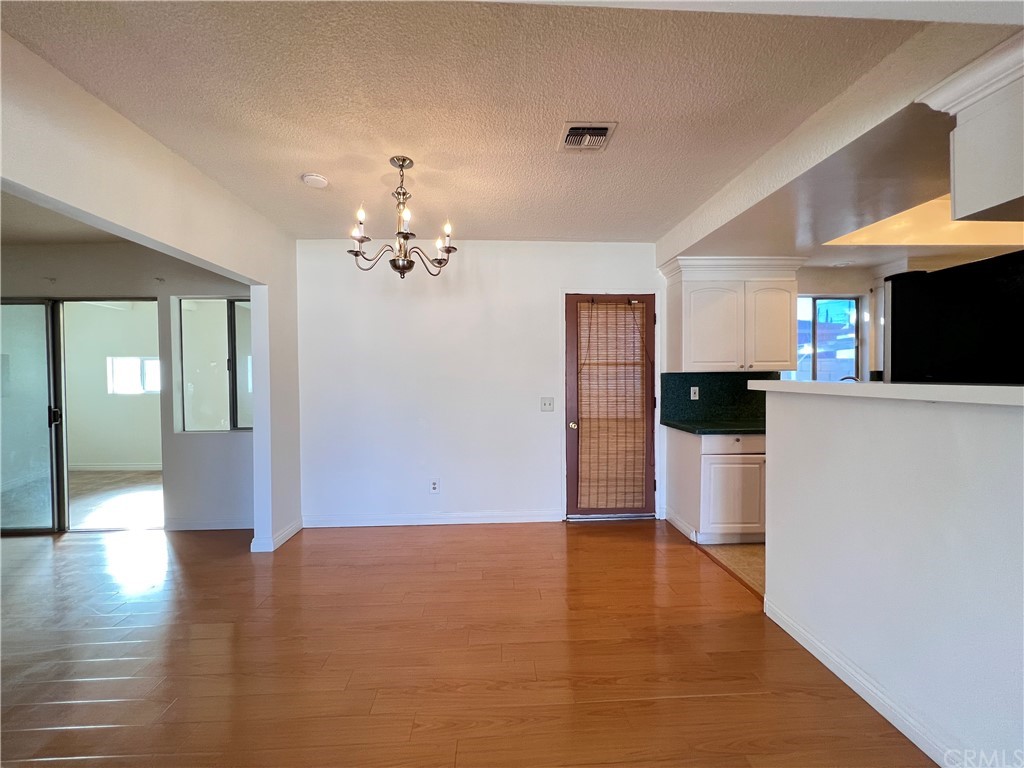 8716 Duarte Road San Gabriel, CA 91775 - Photo 7 of 21 a view of a room with cabinet and wooden floor