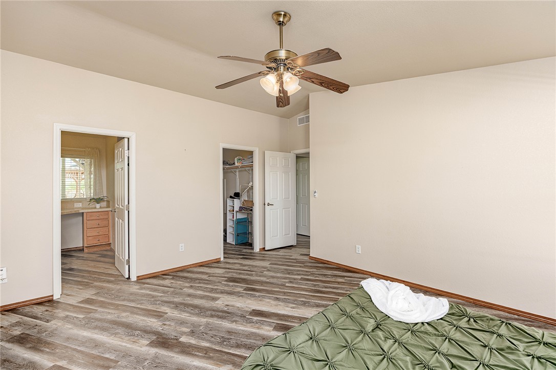 4206 Cordes Road Golden Valley, AZ 86413 - Photo 16 of 60 This property features wood-look flooring and a ceiling fan with integrated lighting