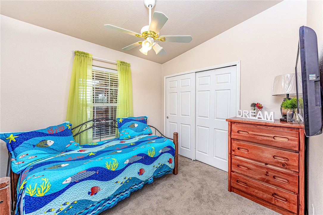 4206 Cordes Road Golden Valley, AZ 86413 - Photo 21 of 60 This room features a vaulted ceiling, a ceiling fan with integrated lighting, and carpeted floors