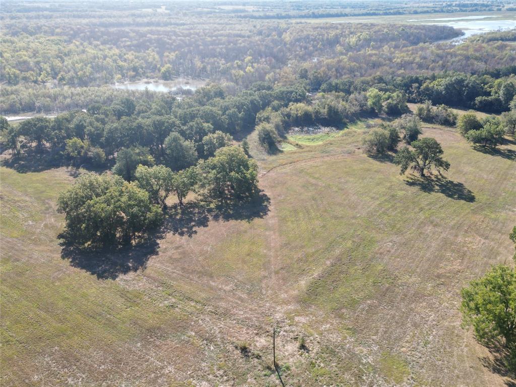 2102 County Road 2610 Bonham, TX 75418 - Photo 11 of 24 a view of a dry yard with green space
