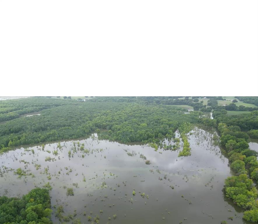 2102 County Road 2610 Bonham, TX 75418 - Photo 21 of 24 a view of a beach with a yard
