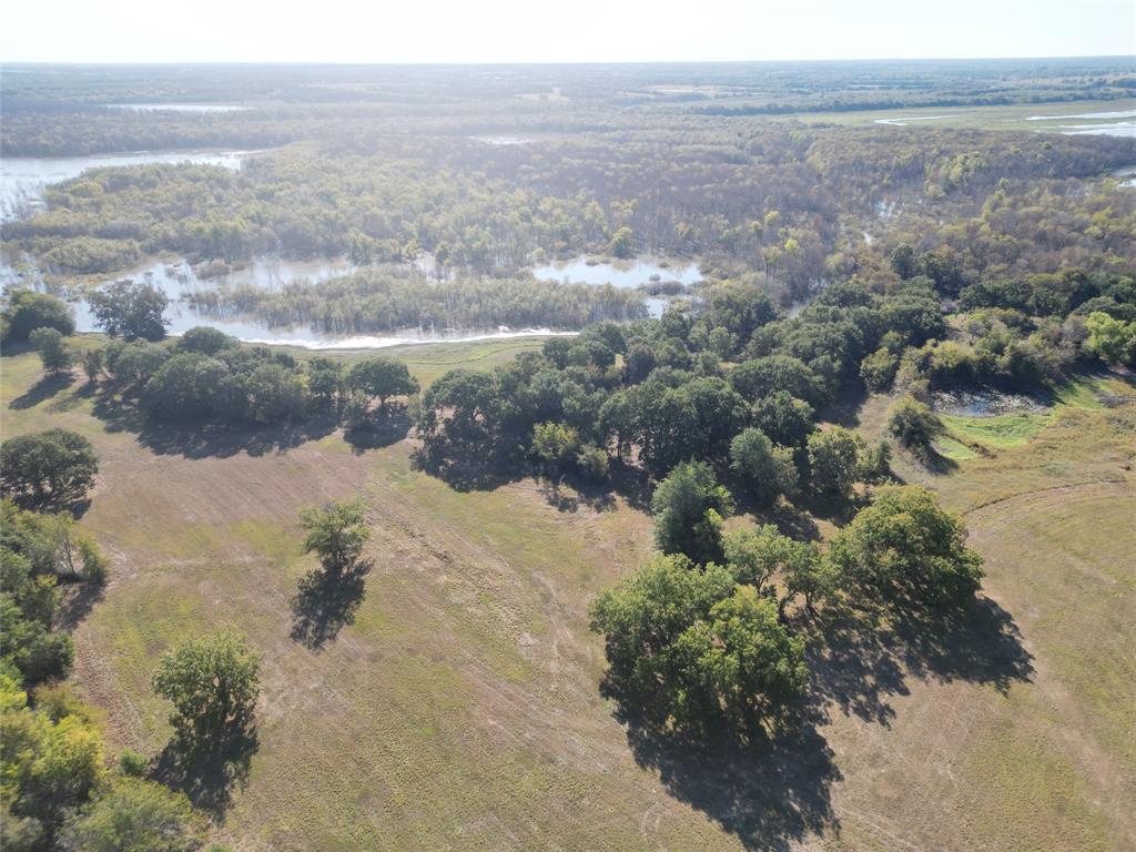 2102 County Road 2610 Bonham, TX 75418 - Photo 9 of 24 a view of a lake with a mountain
