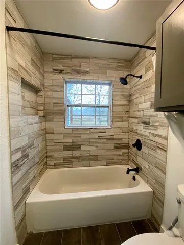 an empty room with a fan