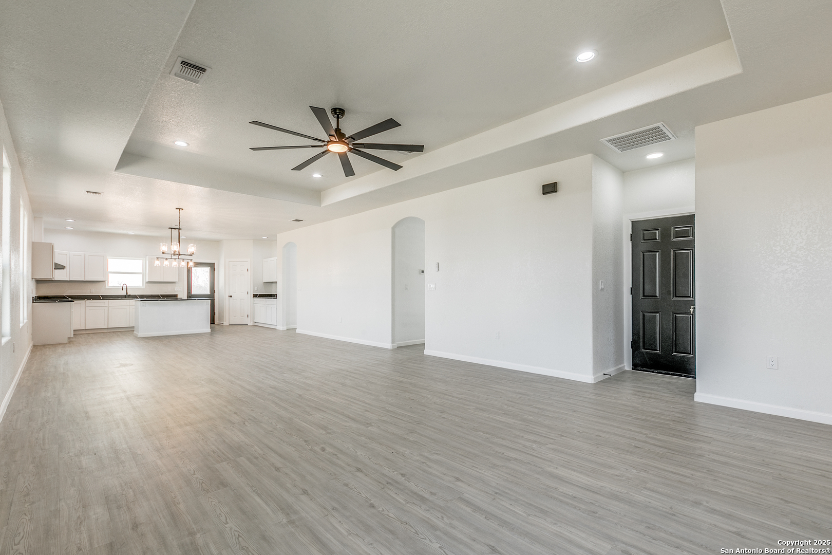 104 Flor Del Sol Road San Antonio, TX 78264 - Photo 13 of 29 a view of an empty room with a kitchen