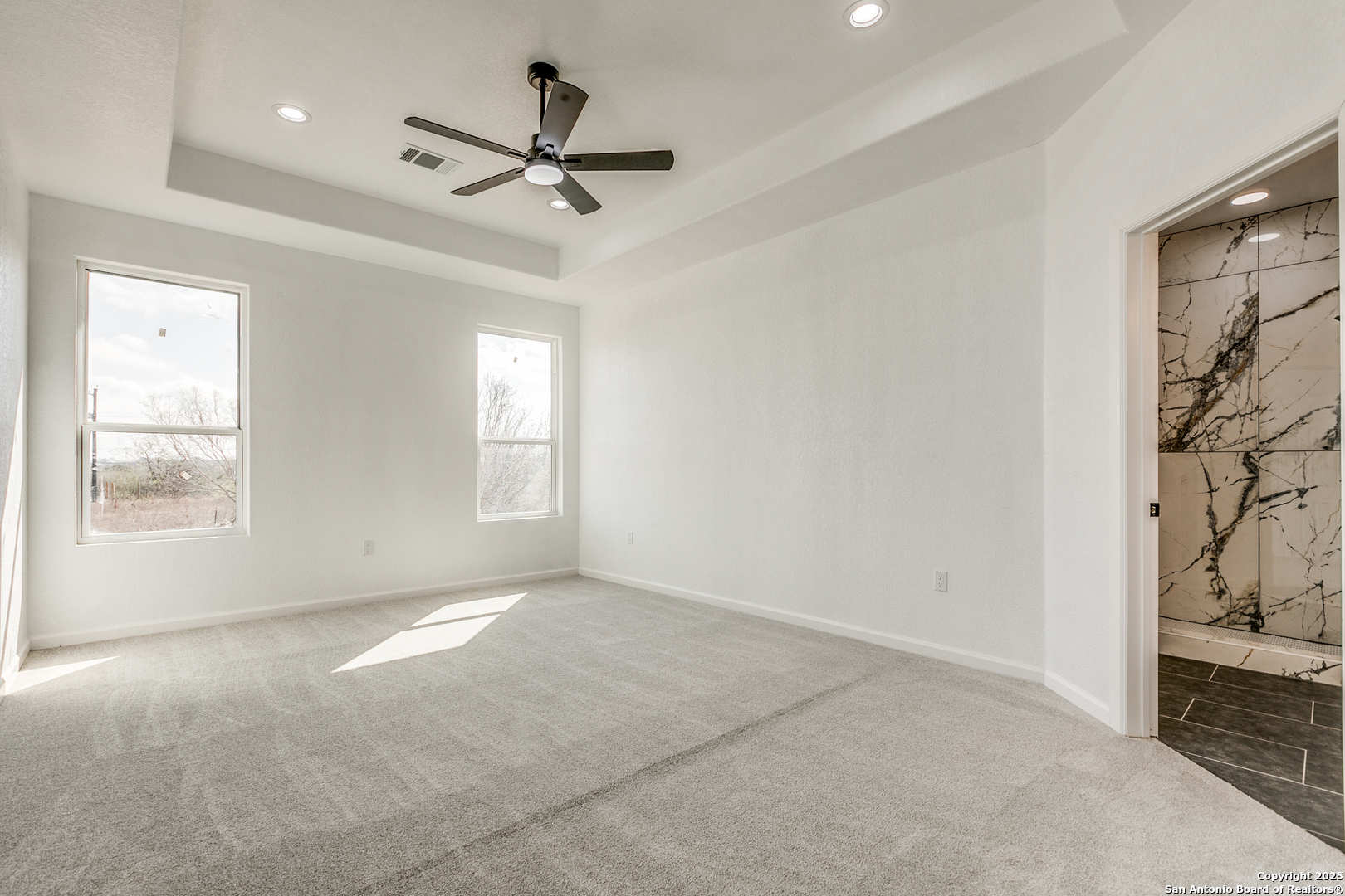 104 Flor Del Sol Road San Antonio, TX 78264 - Photo 24 of 29 a view of a livingroom with a ceiling fan and window
