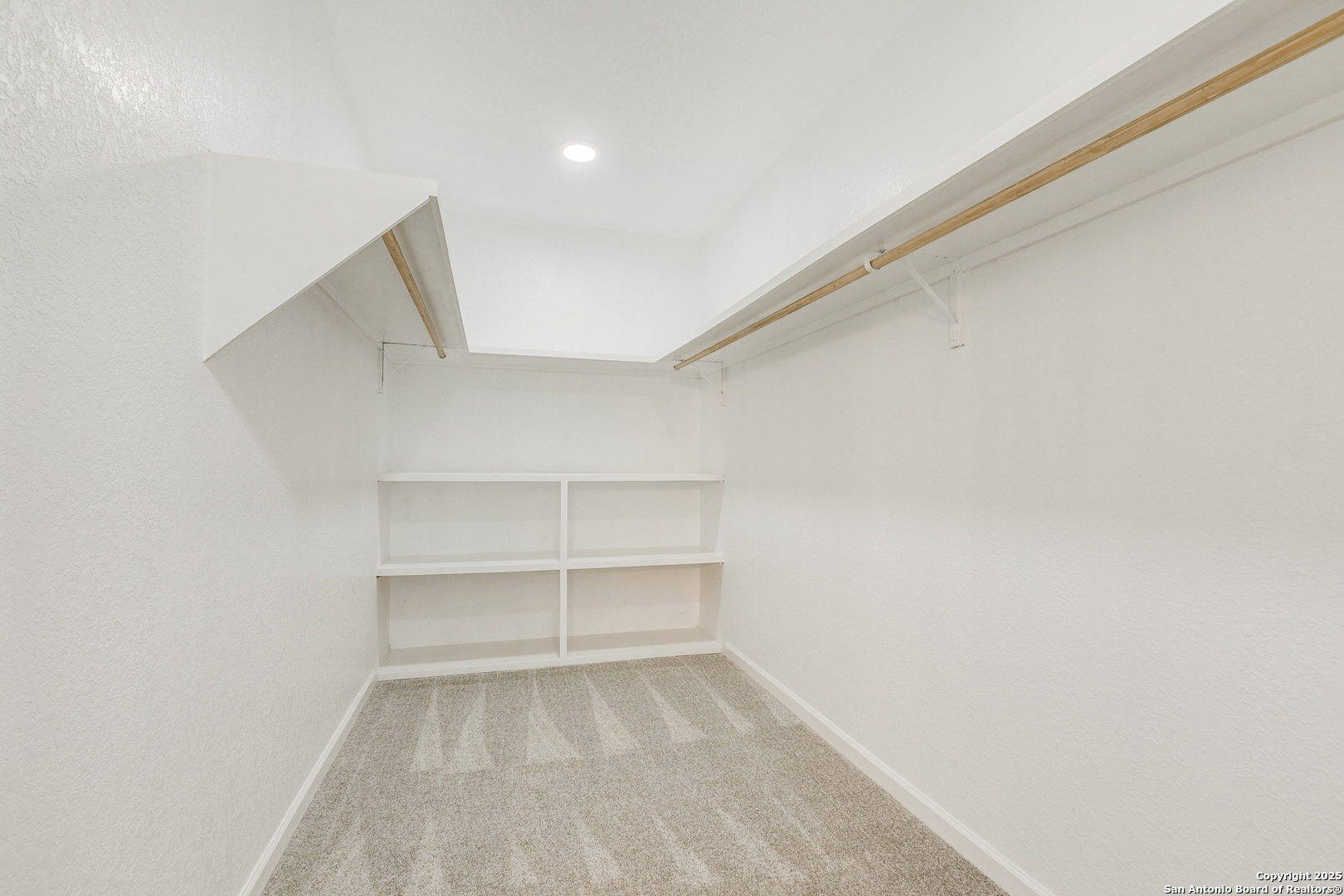 104 Flor Del Sol Road San Antonio, TX 78264 - Photo 27 of 29 a view of a room with rack on the wall