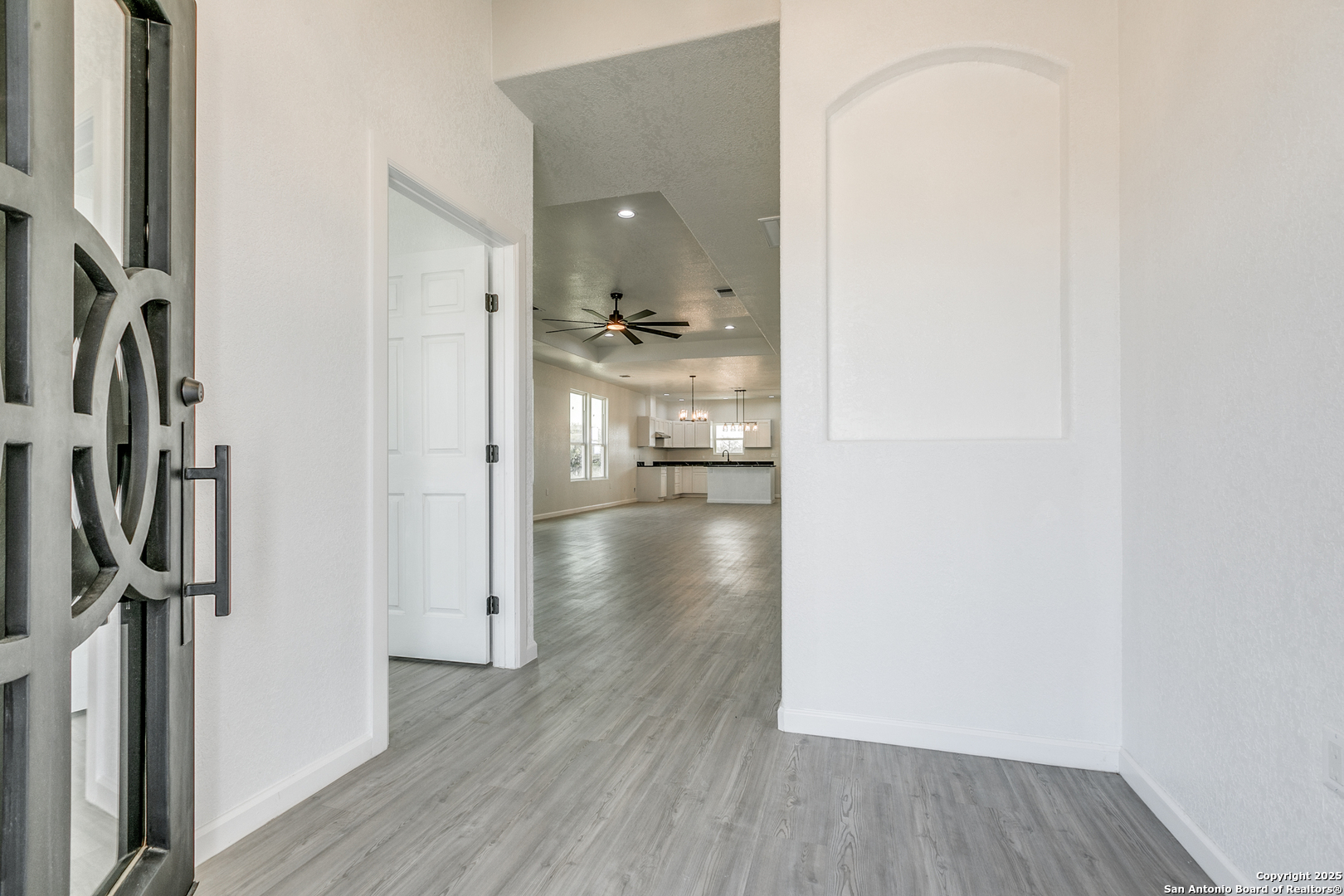 104 Flor Del Sol Road San Antonio, TX 78264 - Photo 5 of 29 a view of a hallway with wooden floor