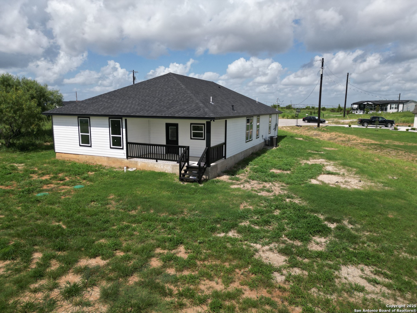 104 Flor Del Sol Road San Antonio, TX 78264 - Photo 7 of 29 a view of a house with a yard