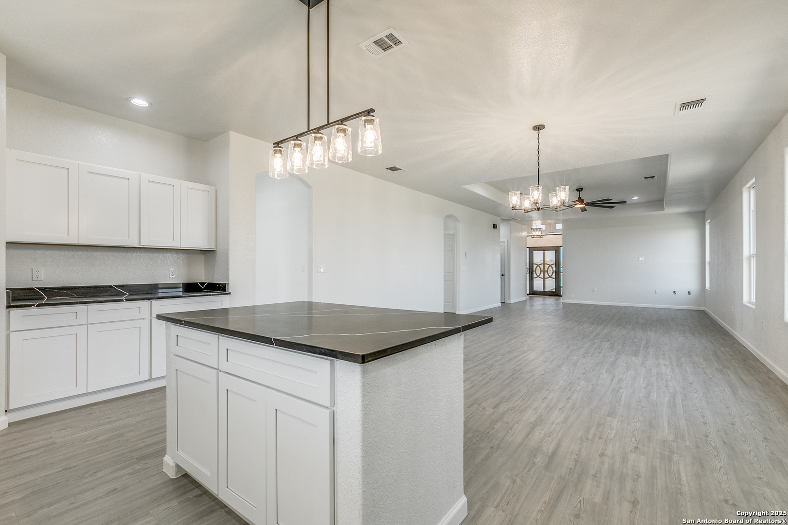 104 Flor Del Sol Road San Antonio, TX 78264 - Photo 8 of 29 a kitchen with a refrigerator a sink and a stove top oven