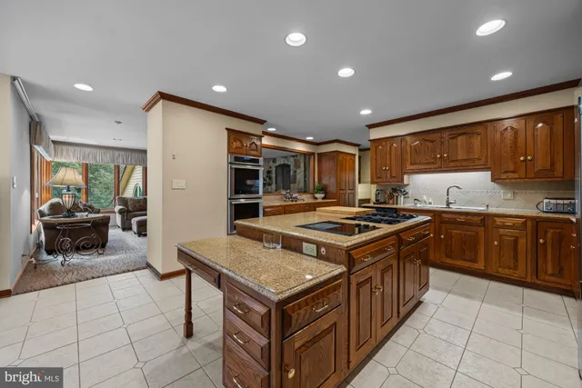 a living room with furniture a rug and a window