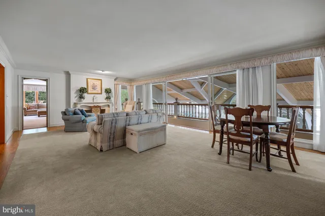 a living room with furniture a window and a sink