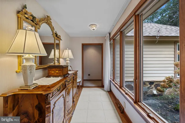 a bed room with a bed and a large window