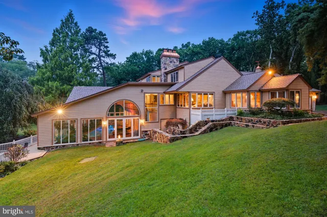 a view of entryway livingroom and hall with wooden floor