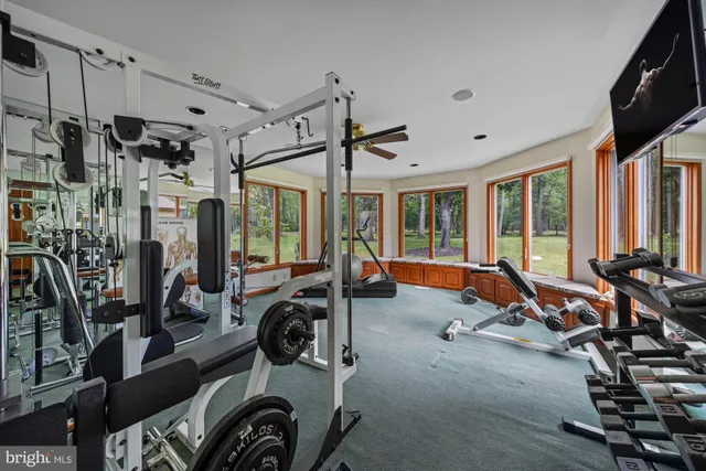 a living room with furniture fireplace and window