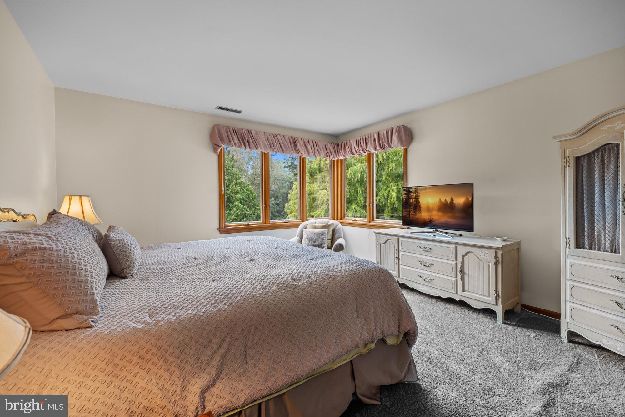 1528 Mays Landing Road Hammonton, NJ 08037 - Photo 38 of 94 a bedroom with a bed and flat screen tv
