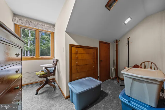 an aerial view of a house with a garden and swimming pool