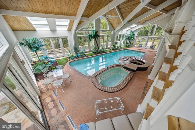 a view of house with backyard and garden