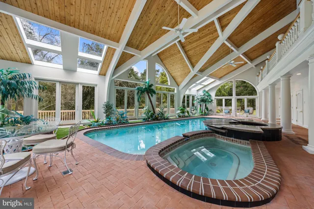 an aerial view of a house with garden space and street view