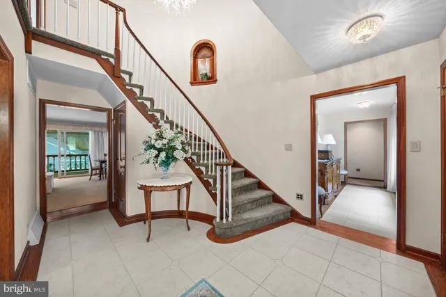 a kitchen with stainless steel appliances granite countertop a stove refrigerator and a sink