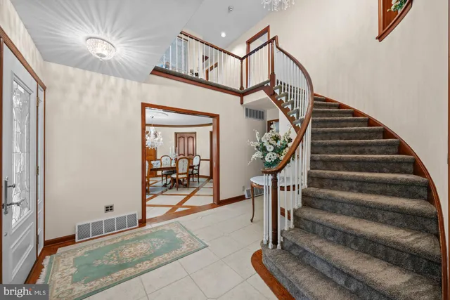 a kitchen with stainless steel appliances granite countertop a stove a refrigerator and a sink