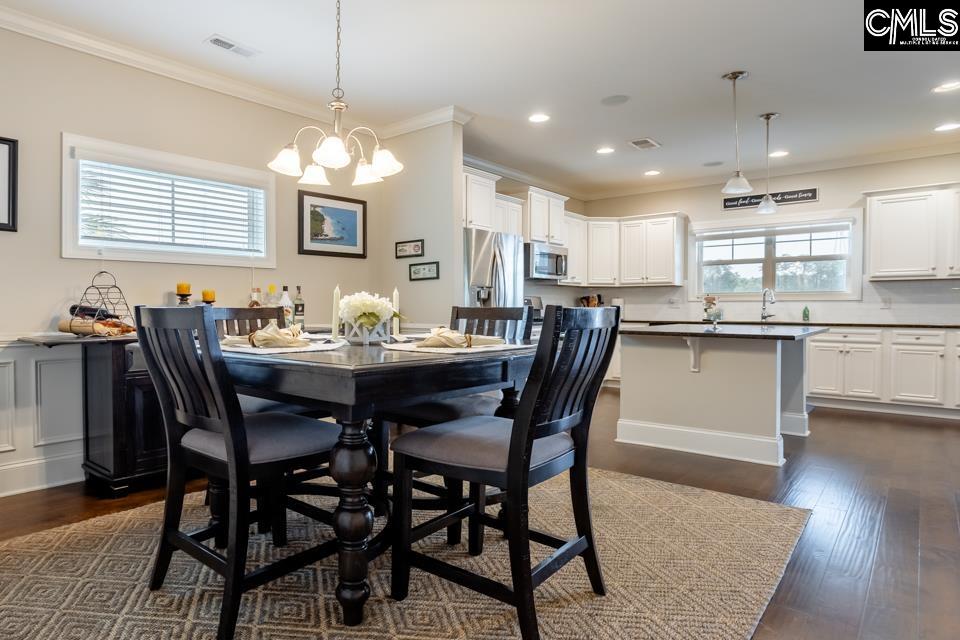 357 Cabana Way Lexington, SC 29072 - Photo 9 of 25 a dining room with a wooden table and chairs