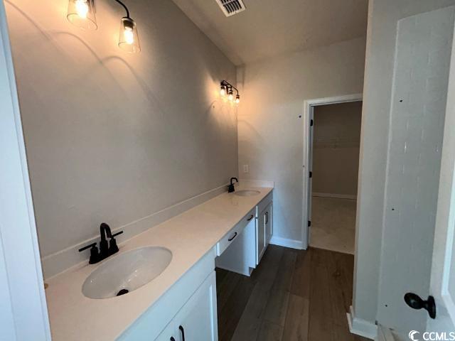 249 Valerio Street Myrtle Beach, SC 29579 - Photo 28 of 39 Bathroom with hardwood / wood-style flooring and v