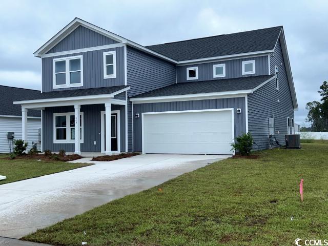 249 Valerio Street Myrtle Beach, SC 29579 - Photo 3 of 39 View of front facade with a garage, a front yard,