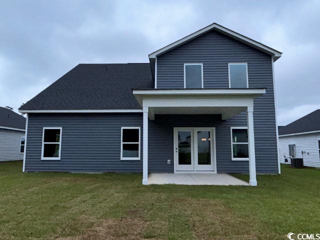 249 Valerio Street Myrtle Beach, SC 29579 - Photo 6 of 39 Rear view of property with a yard and a patio