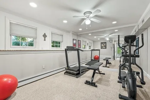 a bathroom with a toilet a sink and a large mirror
