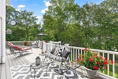 a patio with hardwood table and chairs