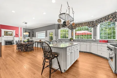 a kitchen with stainless steel appliances granite countertop a sink and cabinets